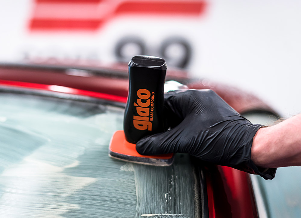 Photo of a car's windscreen being deep-cleaned with Soft99's Glaco Compound Roll On glass cleaner. The product removes all dirt, waterspots, residue, including deep-seated dirt that accumulates on the car's windscreen after prolonged periods of use.